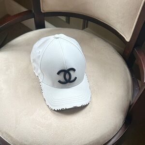 CHANEL White Cap with Black Emblem